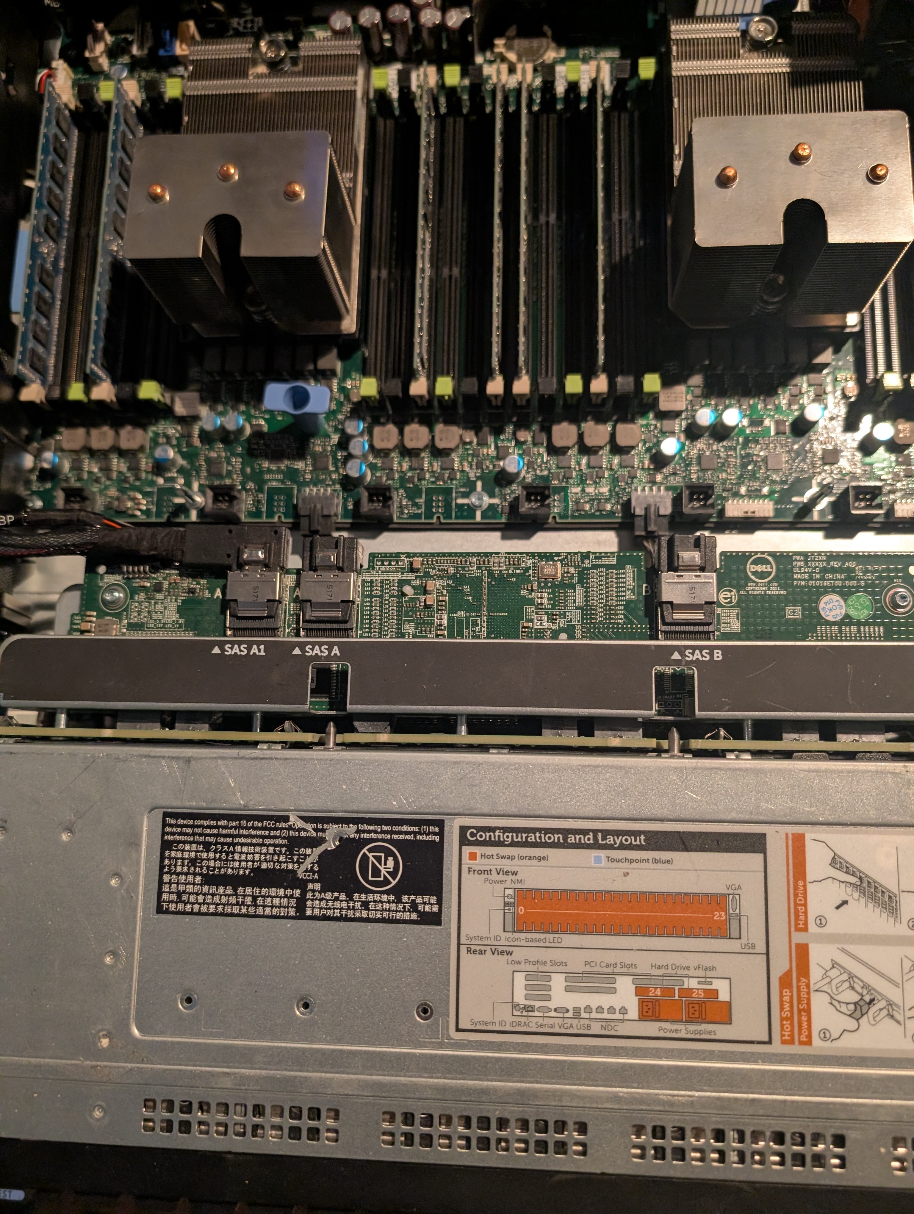 Close-up of server motherboard, CPU heatsinks, and SAS backplane connectors